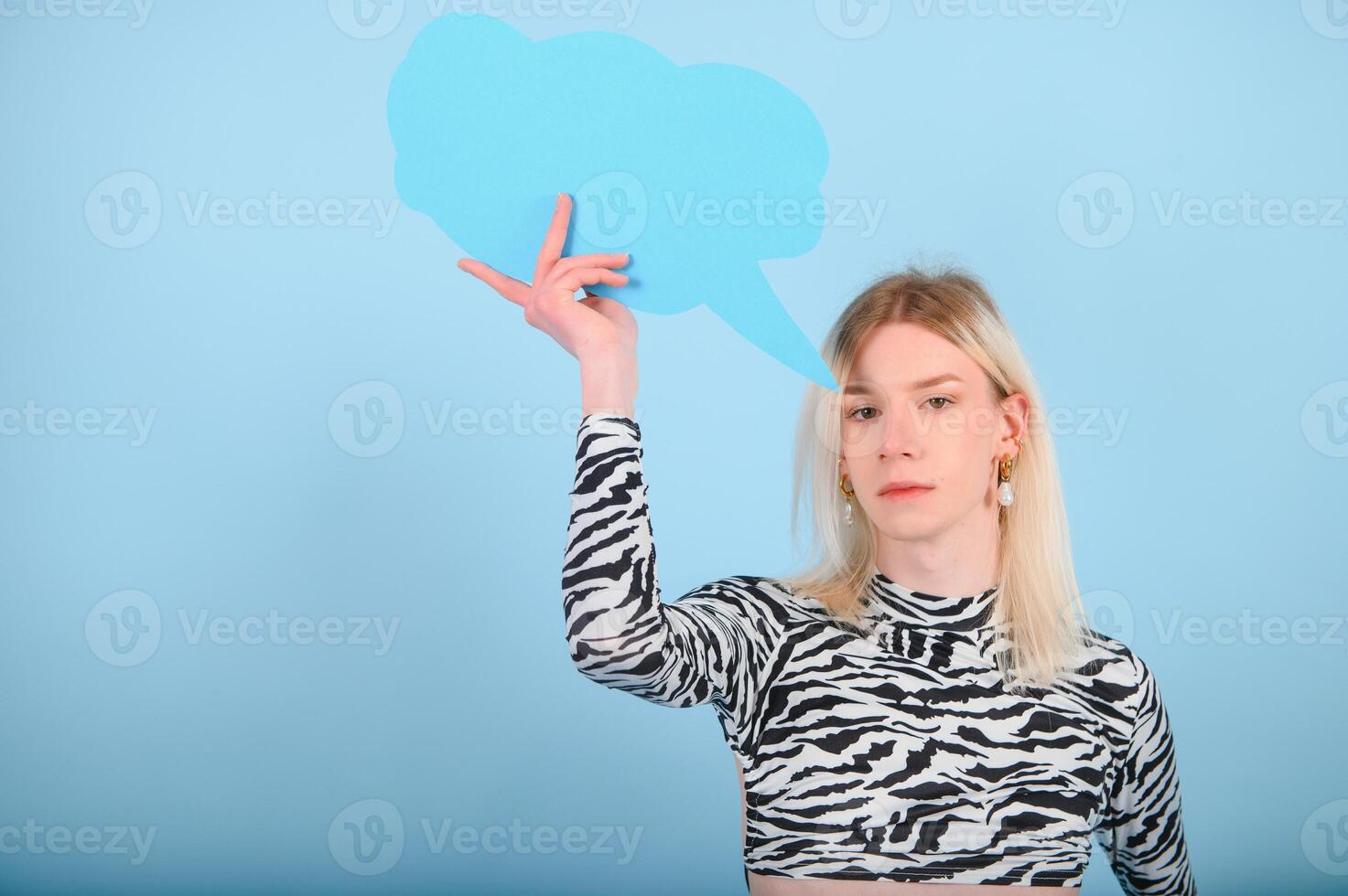 Fashionable young transgender woman on color background photo