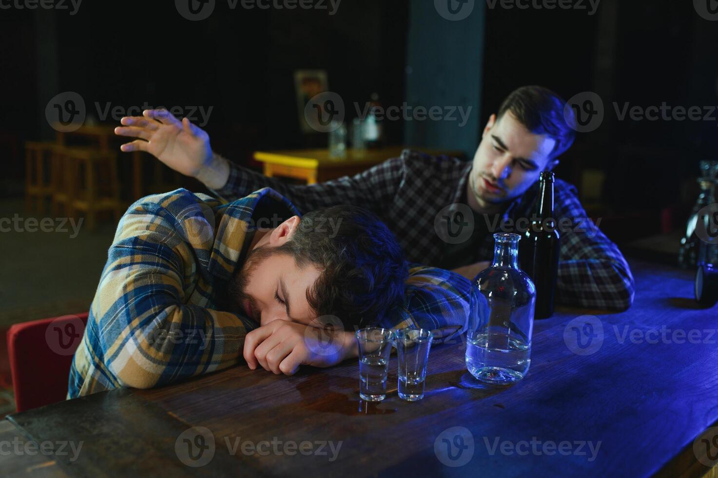 Sad man sitting at bar counter, alcohol addiction photo