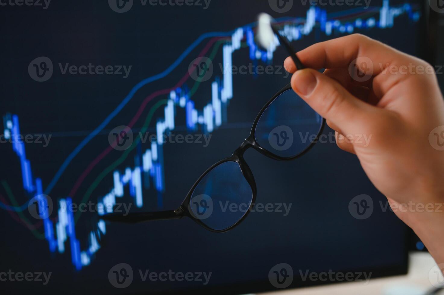 Businessman hand analysing financial stock market graph on board. Trading data index investment growth chart. Cryptocurrency and Forex Concept. photo