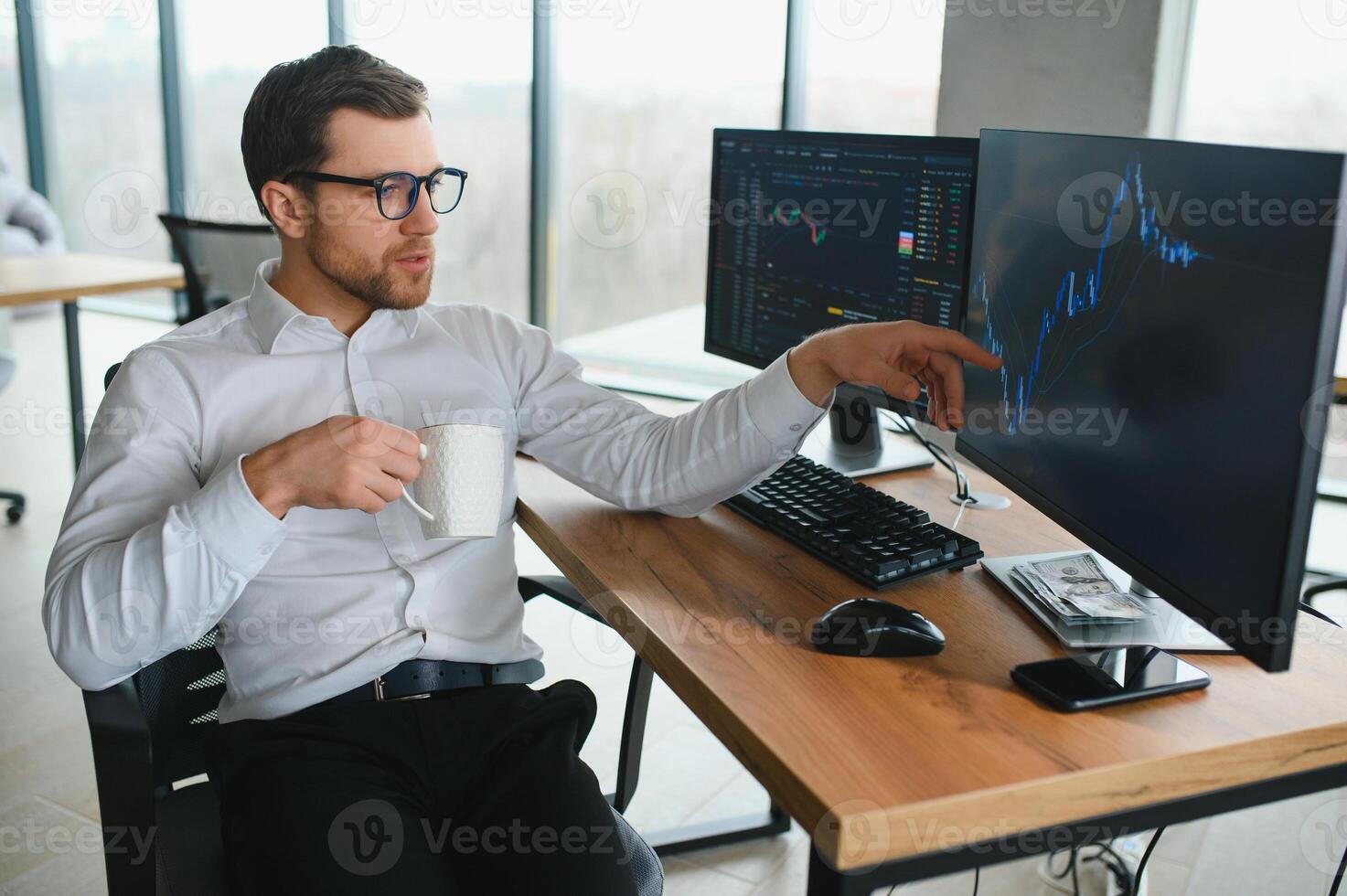 Serious business man trader analyst looking at computer monitor, investor broker analyzing indexes, financial chart trading online investment data on cryptocurrency stock market graph on pc screen. photo