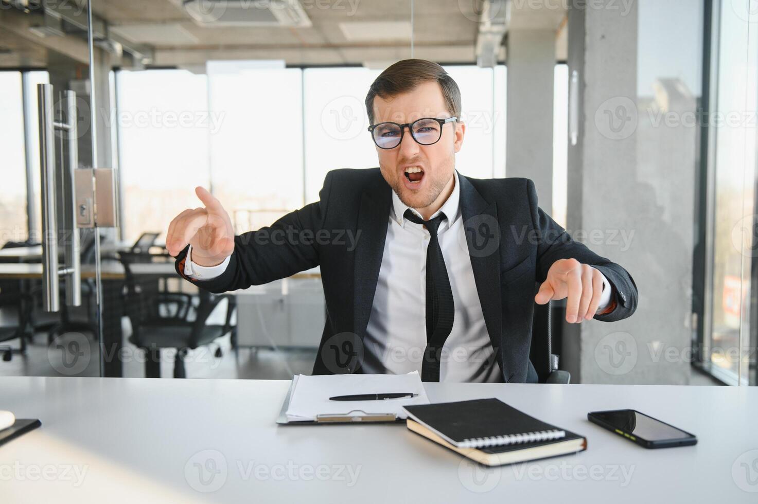 Busy businessman under stress due to excessive work photo