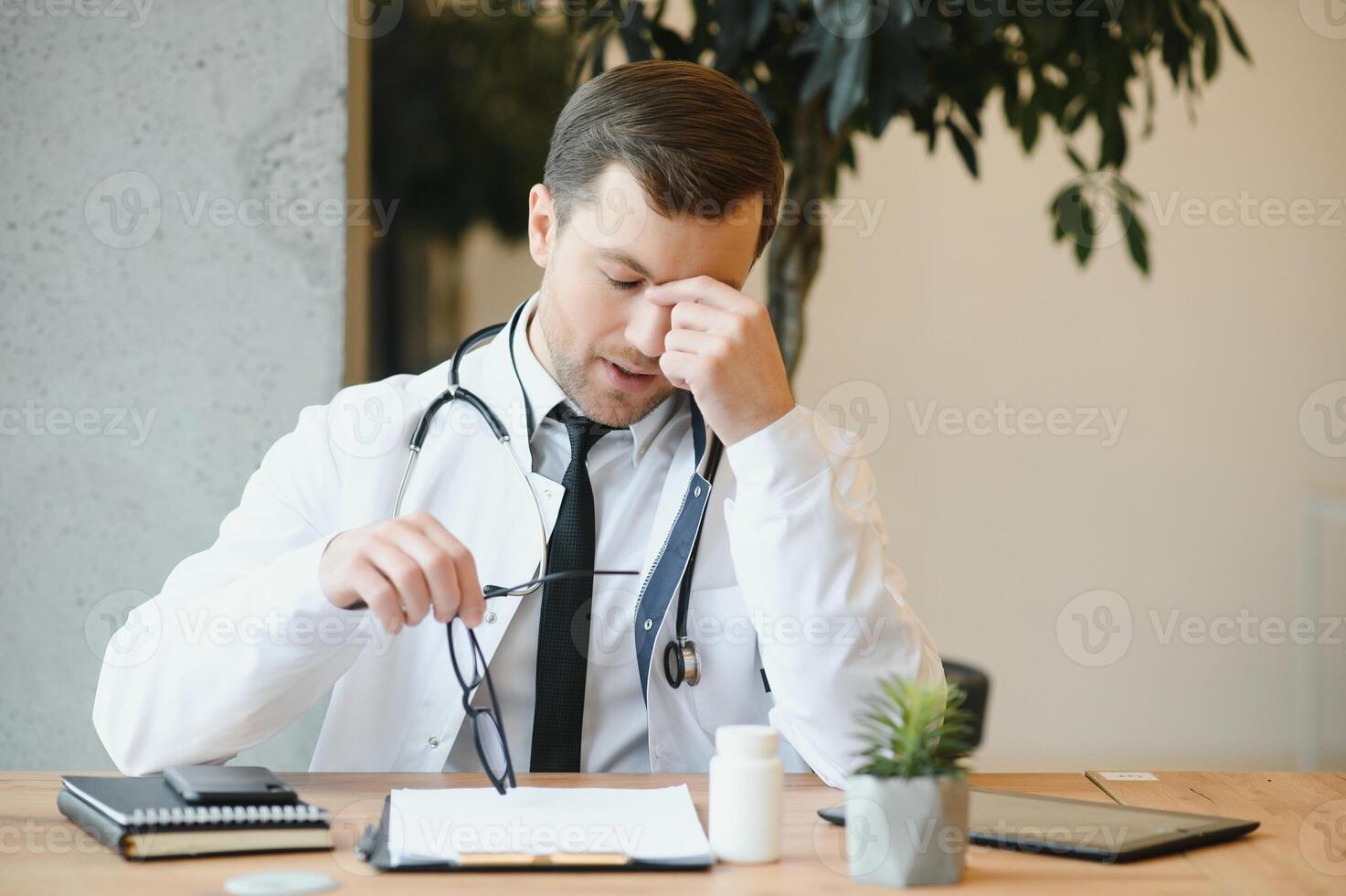 Male doctor working in clinic photo