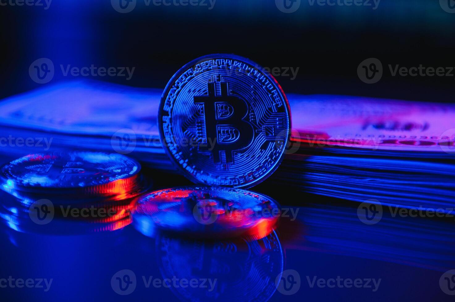 A symbolic coins of bitcoin on banknotes of dollars. Exchange bitcoin cash for a dollar. photo