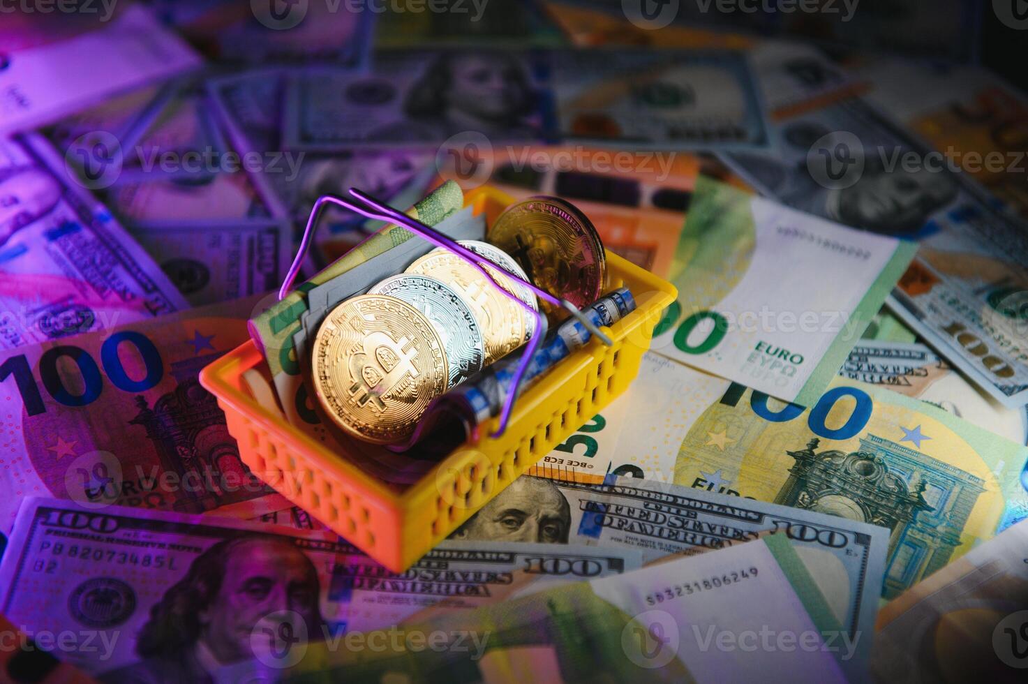 Close up heap of golden bitcoin physical coins on top of Euro, dollar banknotes background, high angle view, selective focus photo