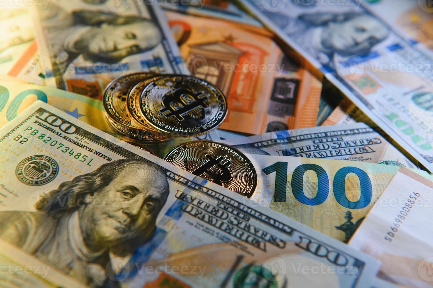 Bitcoin on background of US dollars, euro banknotes. Electronic decentralized money, exchange rate and growth of crypto currency photo