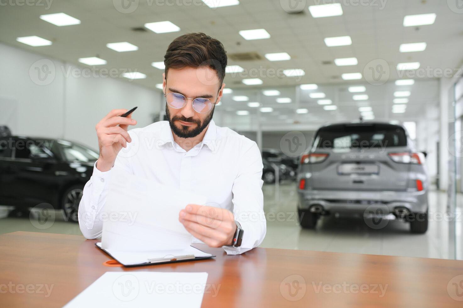 I have a new car. client signing car lease form. photo