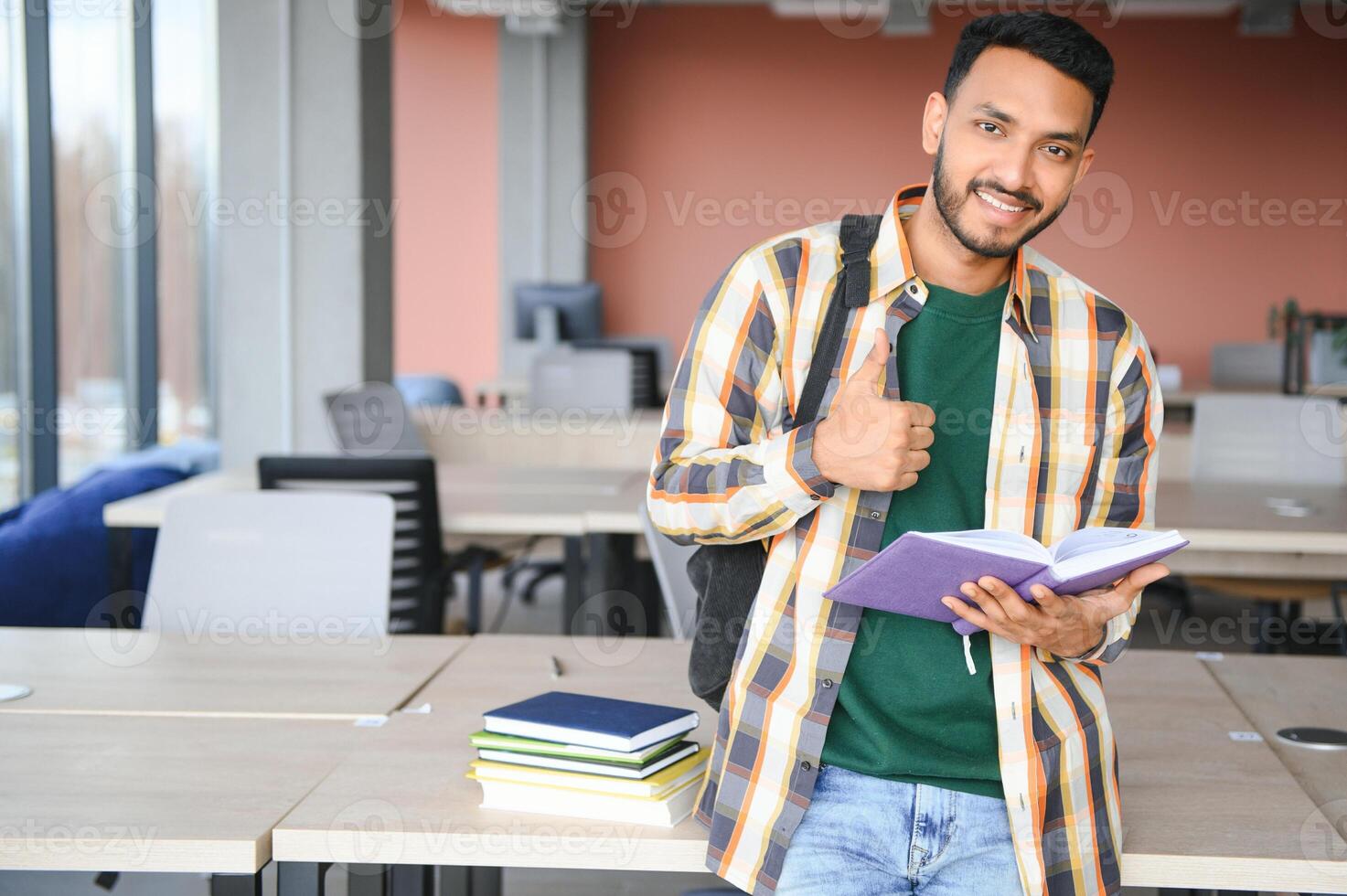 Handsome and young indian Male college student. photo