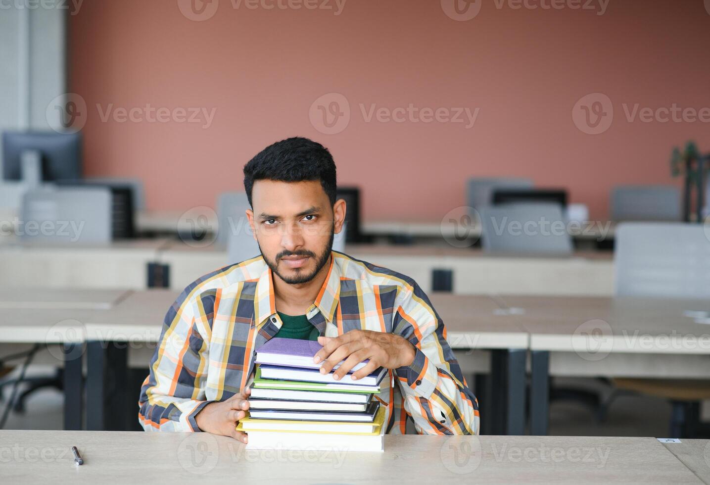 indian student with books at university photo