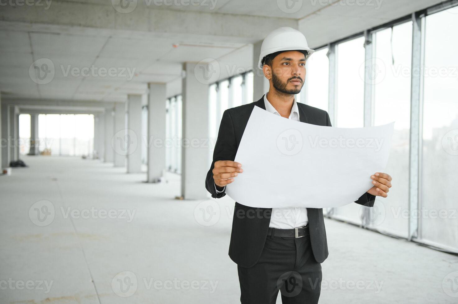 Portrait of a Indian engineer posing at the camera photo