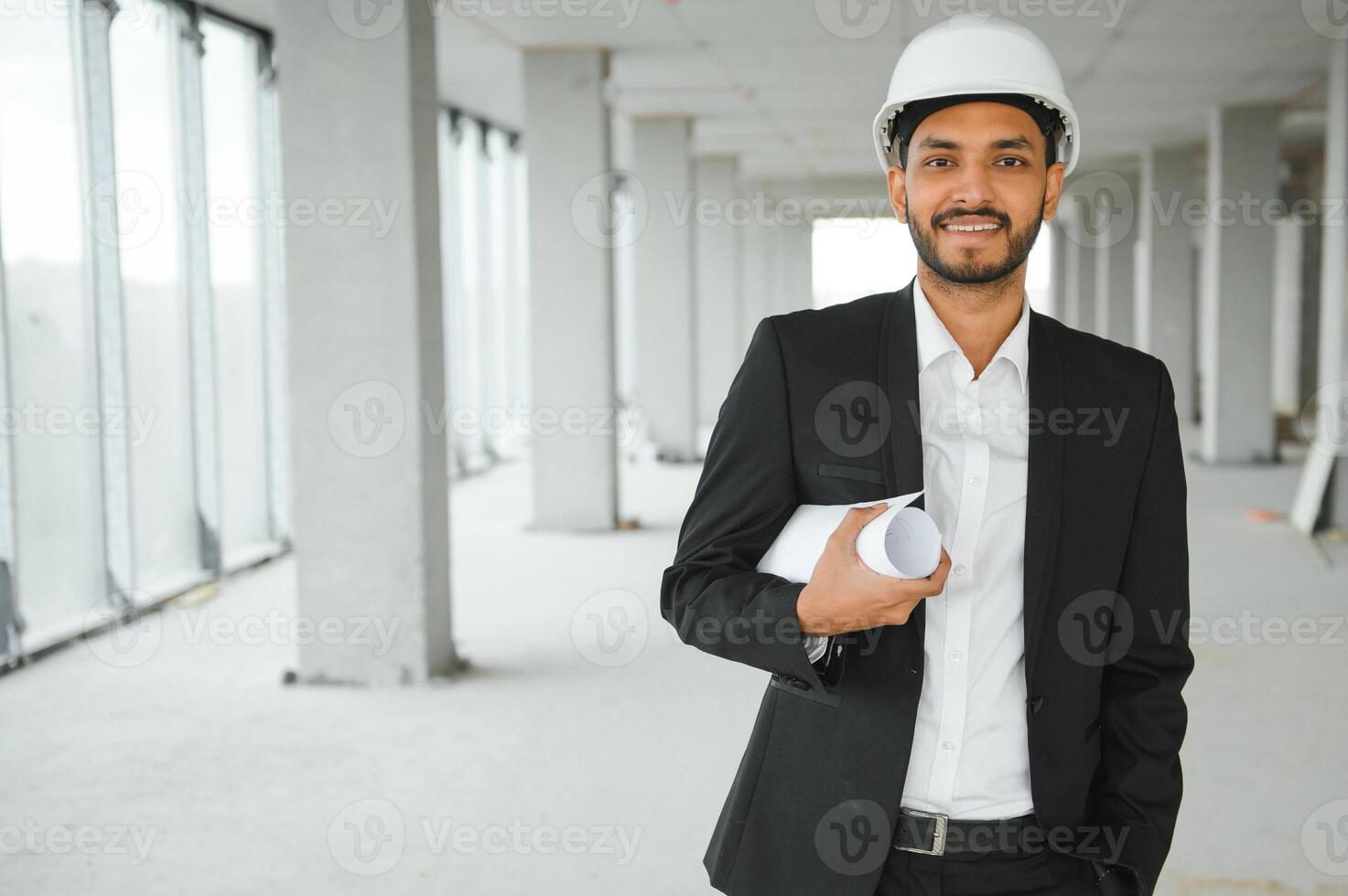 Portrait of a Indian engineer posing at the camera photo