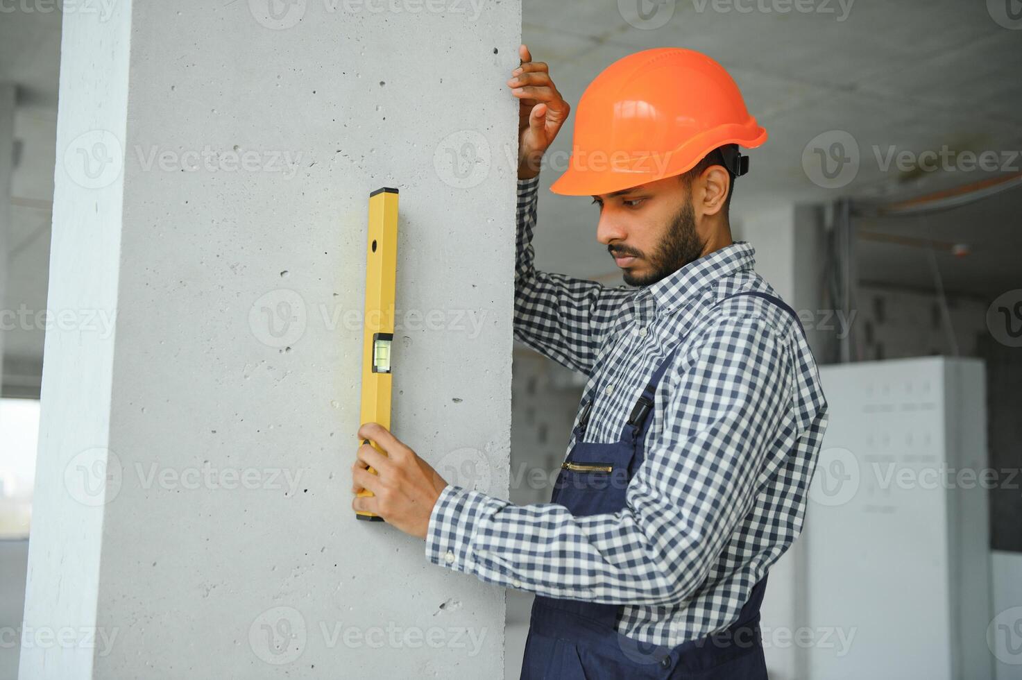 A migrant worker poses for a photo on a city centre construction site in Singapore. The SE Asian city state has a significant migrant worker population
