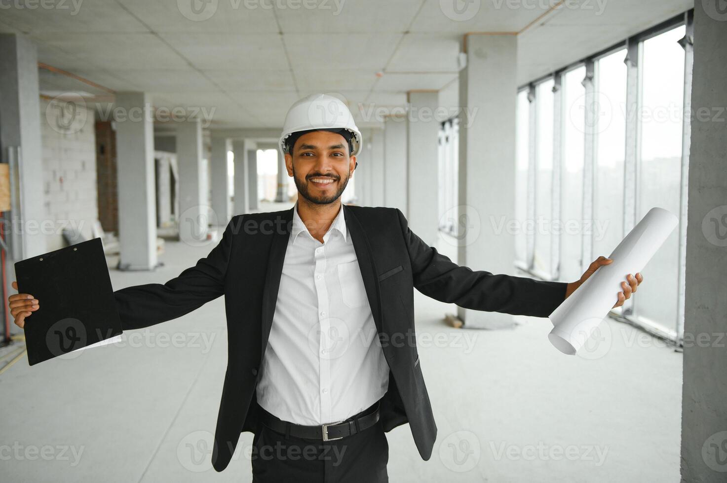 Asian Engineer standing on site construction posting confident , Engineer construction happy job success with in target planning photo