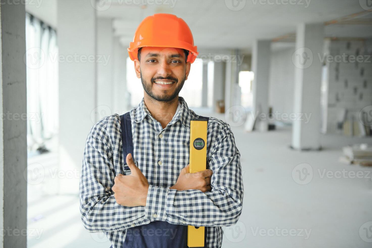 building, construction and people concept. Builder at construction photo