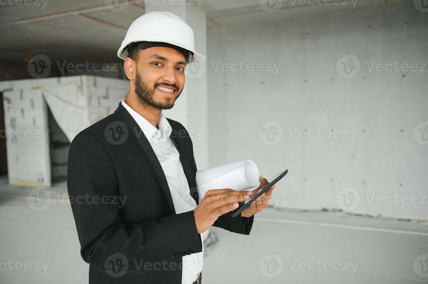 Portrait of a Indian engineer posing at the camera photo