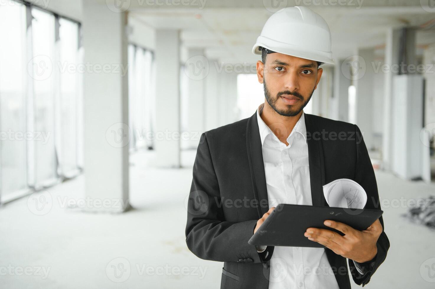 Portrait of a Indian engineer posing at the camera photo