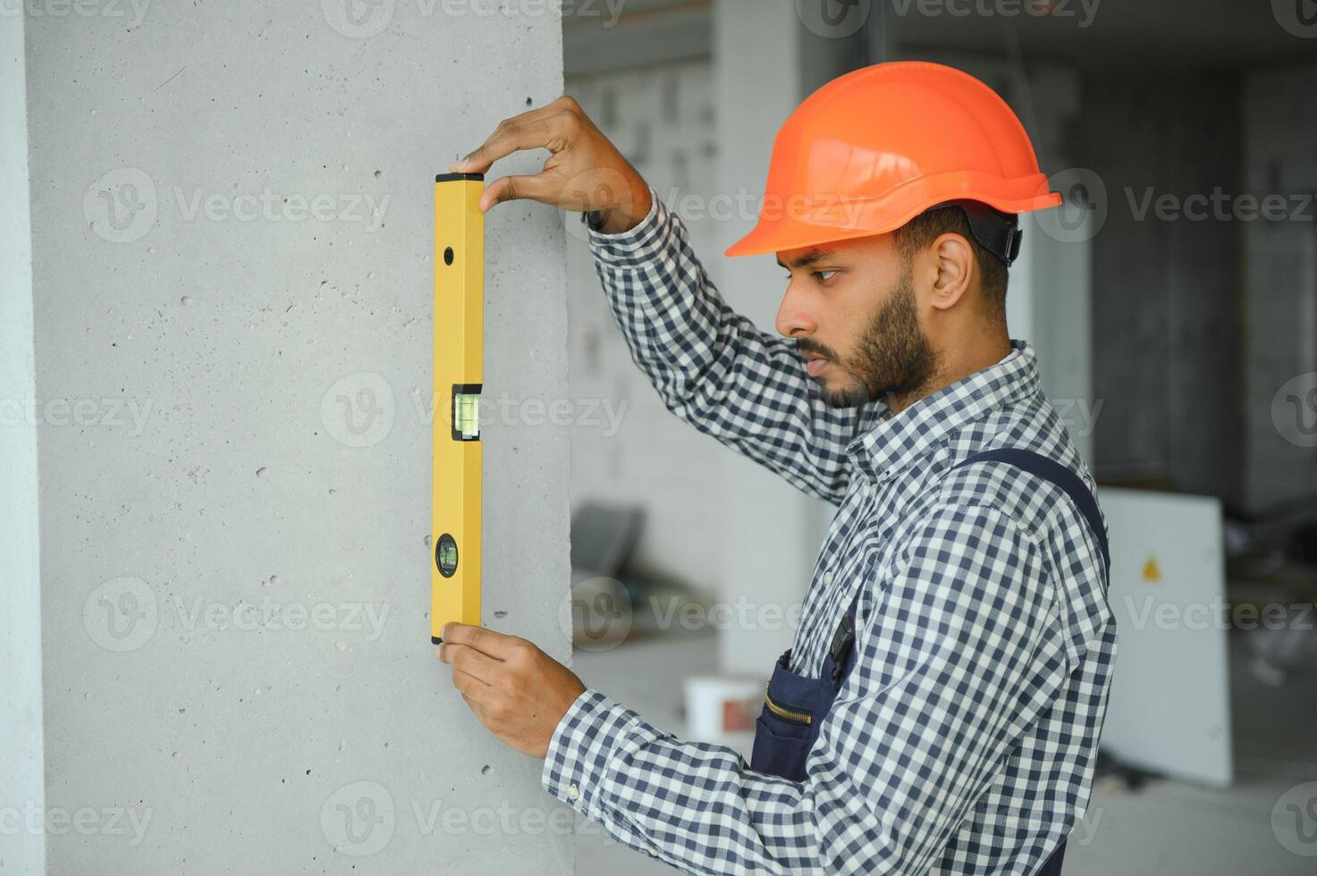 building, construction and people concept. Builder at construction photo