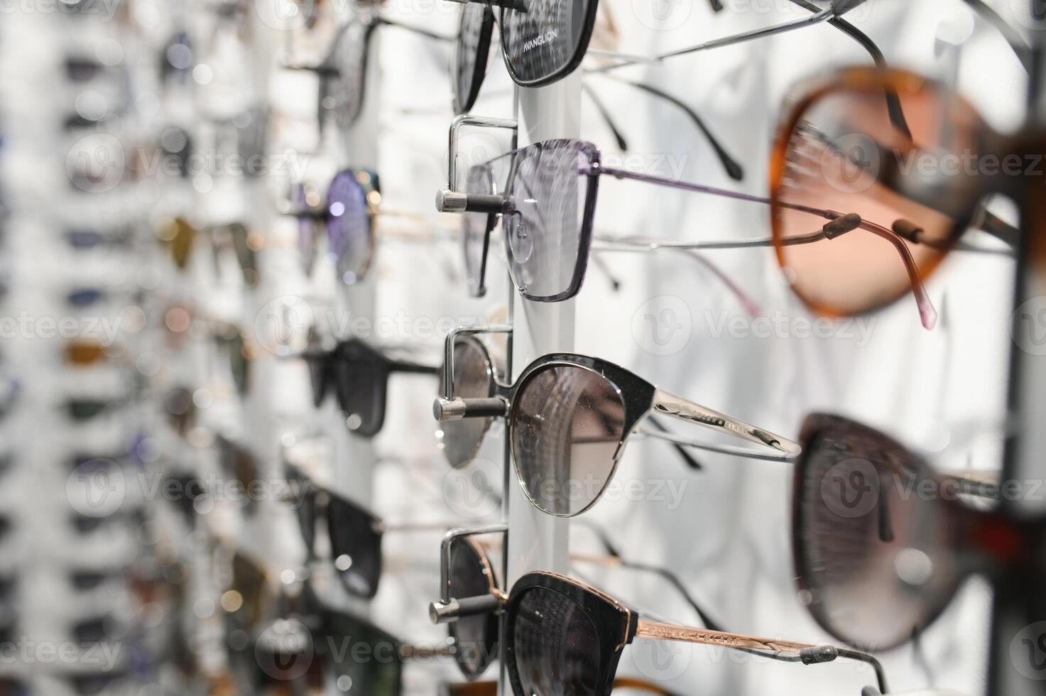Stand with sunglasses. Sale the city market or in the store sunglasses. Trendy sunglasses, Summer eyeglasses, fashion collection, Different sunglasses on a stand photo
