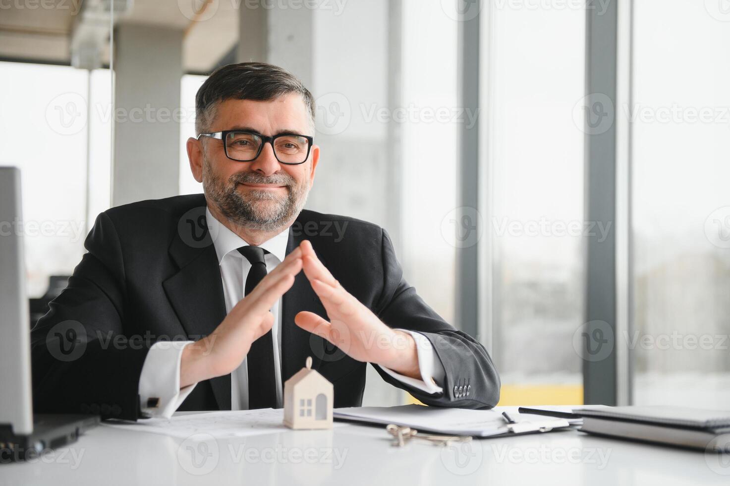 Real estate company to buy houses and land are delivering keys and houses to customers after agreeing to make a home purchase agreement and make a loan agreement. Discussion with a real estate agent photo