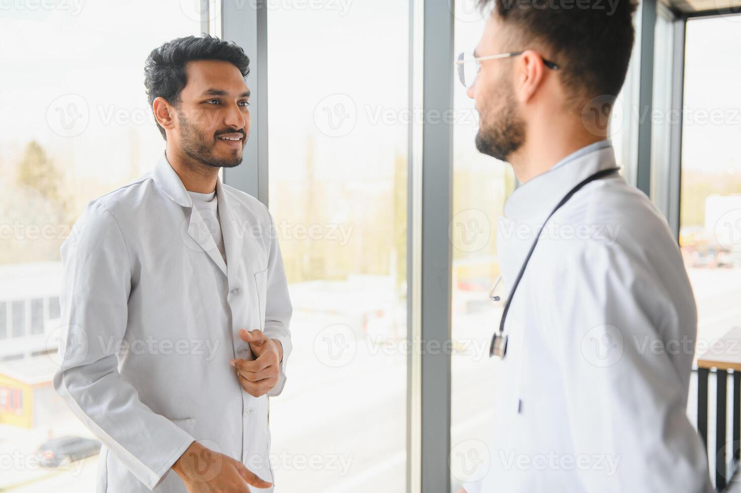 An Indian doctor and an Arab doctor in a hospital photo