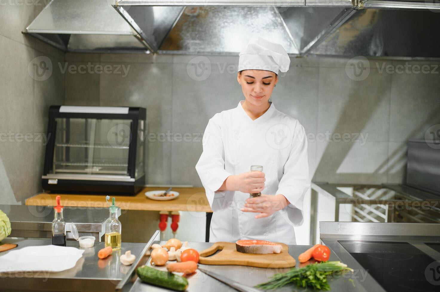 Professional female chef in a hat photo