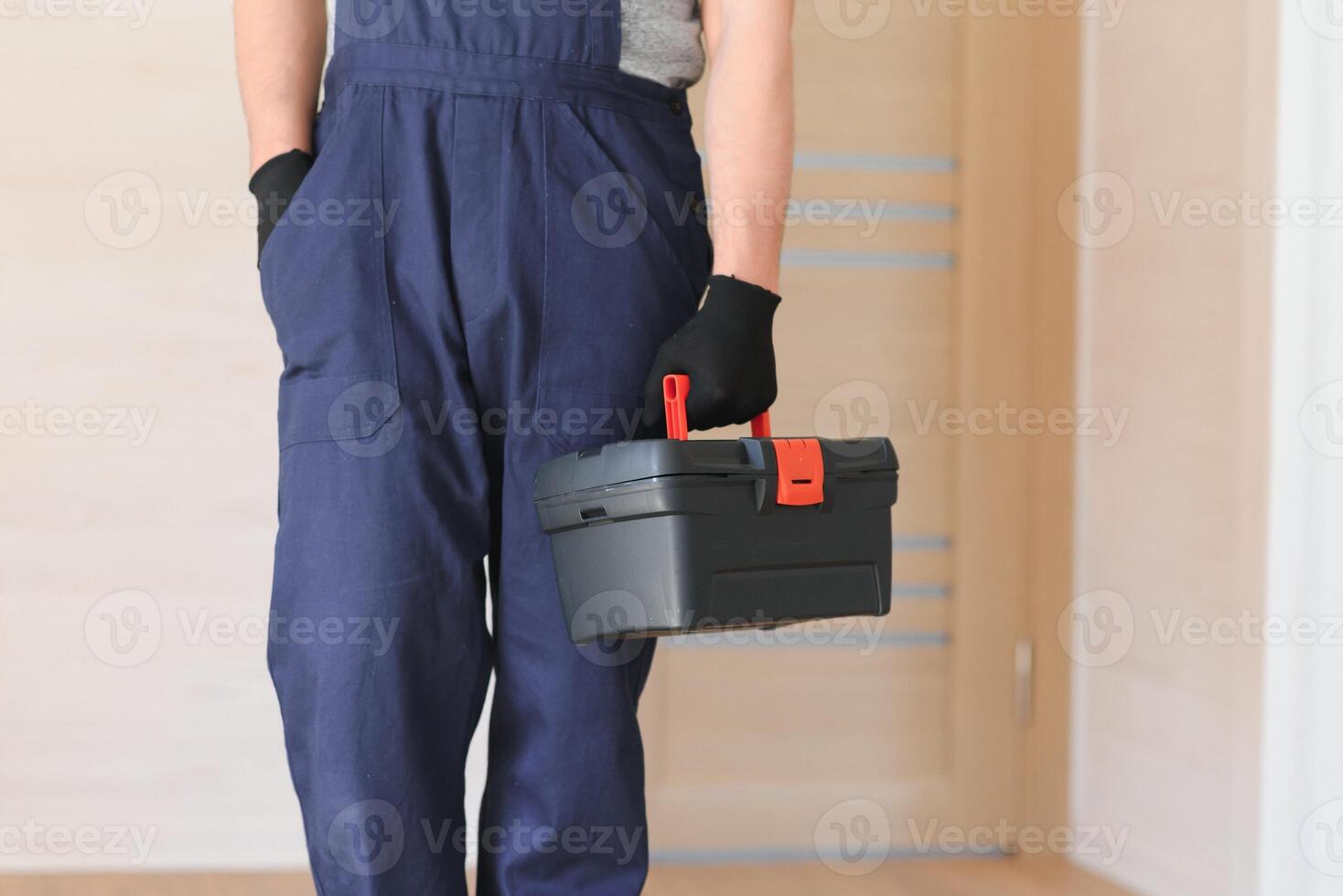 Construction worker installing new window in house photo