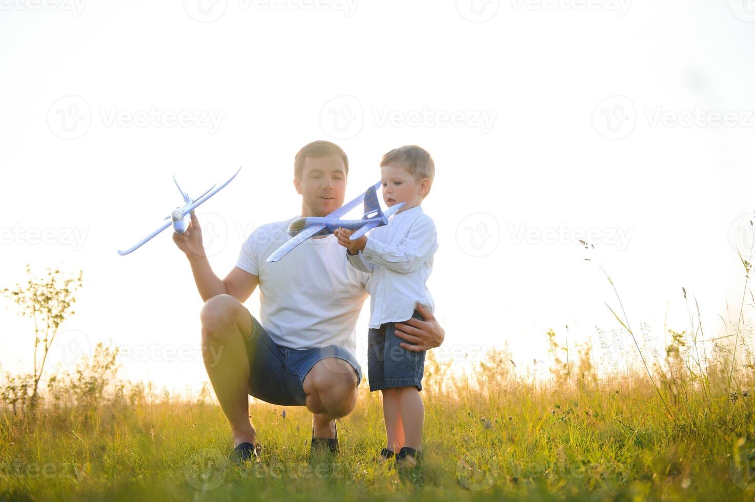 father's day. Dad and son playing together outdoors on a summer. Happy family, father, son at sunset. photo