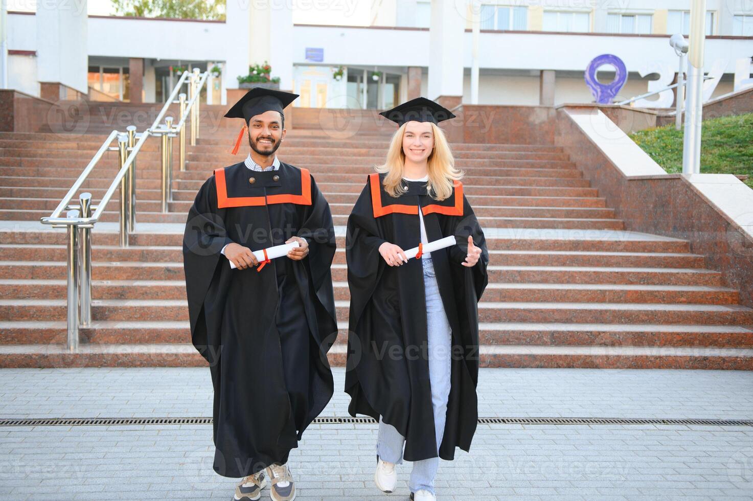 education, graduation and people concept - group of happy international students. photo