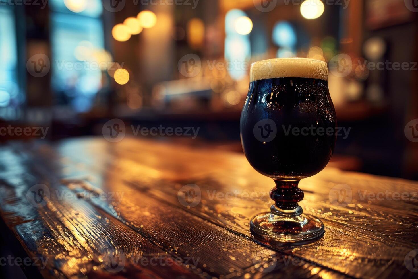 Dark, frothy beer sits on a rustic wooden table in a cozy pub, inviting relaxation in the warm, dim lighting photo