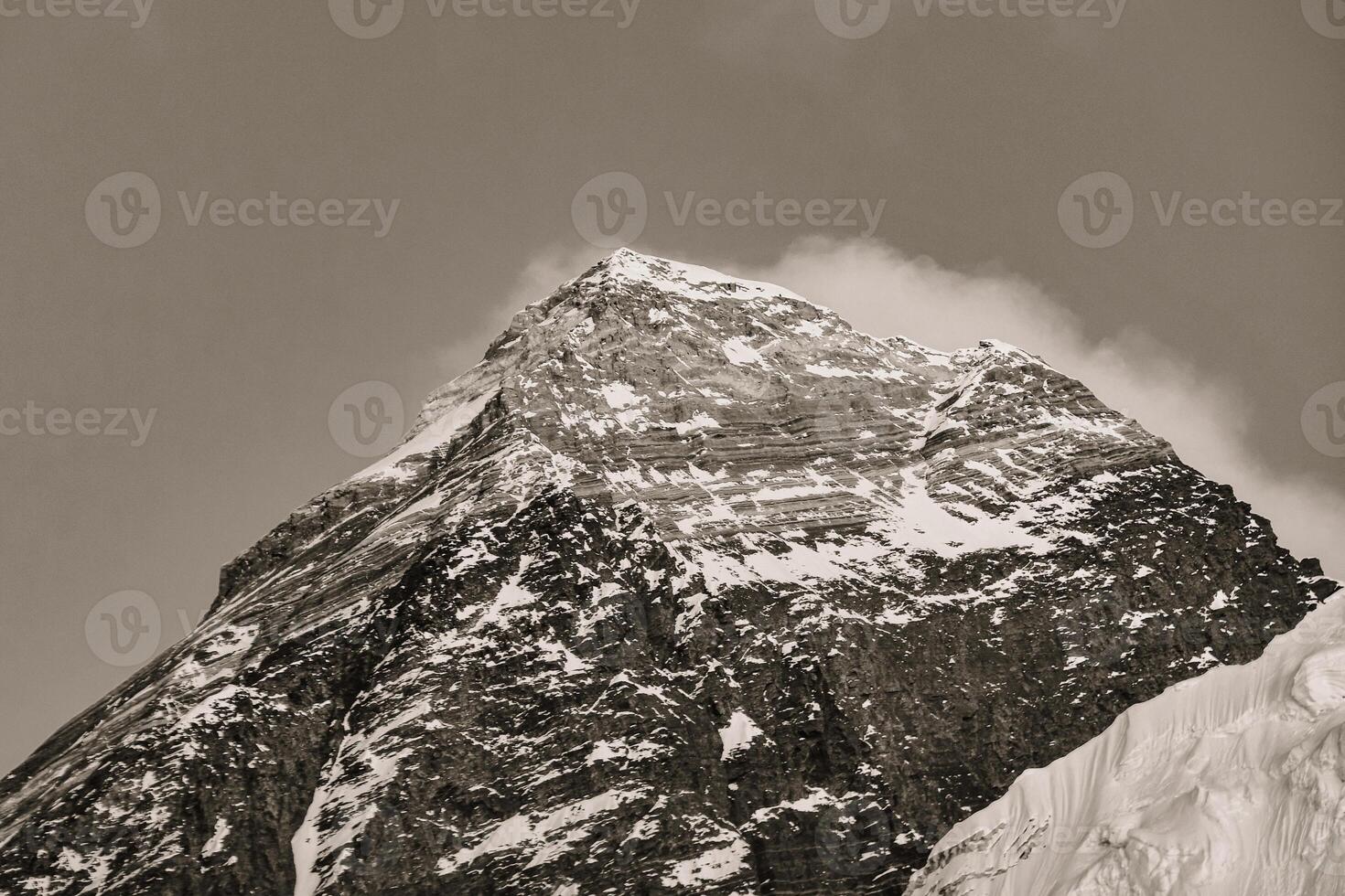 Close up monochrome background Mount Everest peak covered in clouds stormy weather.Khumbu valley, Solukhumbu, Sagarmatha national park, Nepal. Top of the world. 8000er.Highest peak photo