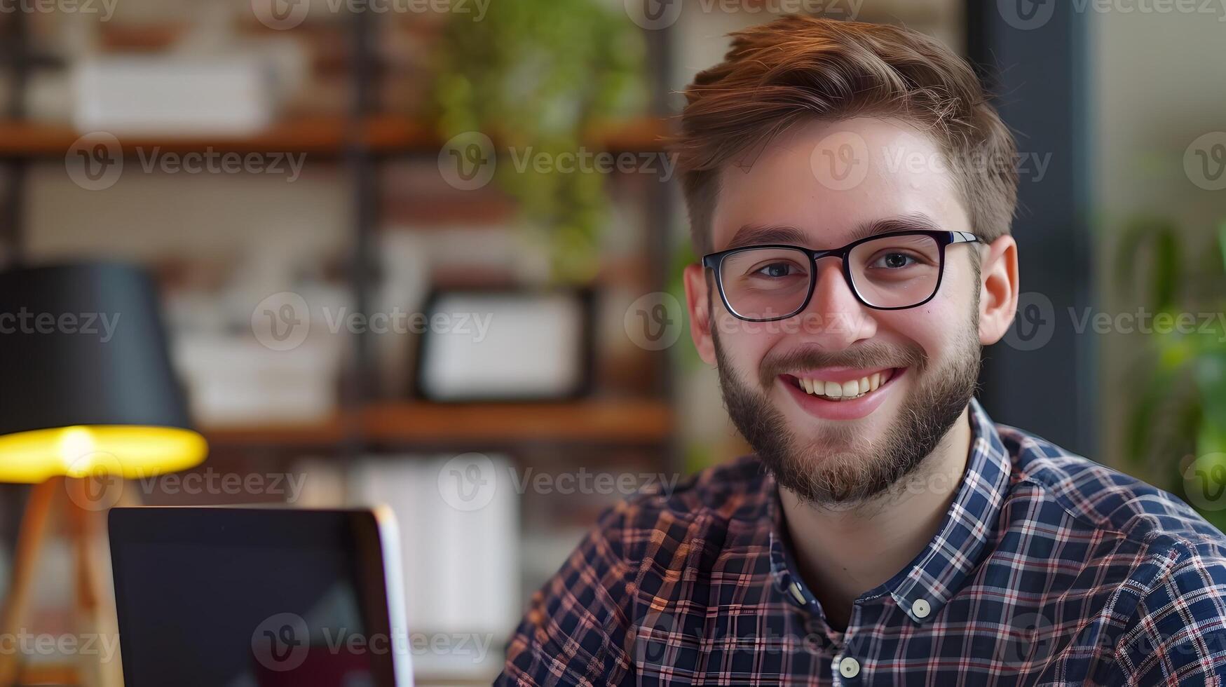 Confident Young Professional Smiling at Desk in Modern Office Setting photo