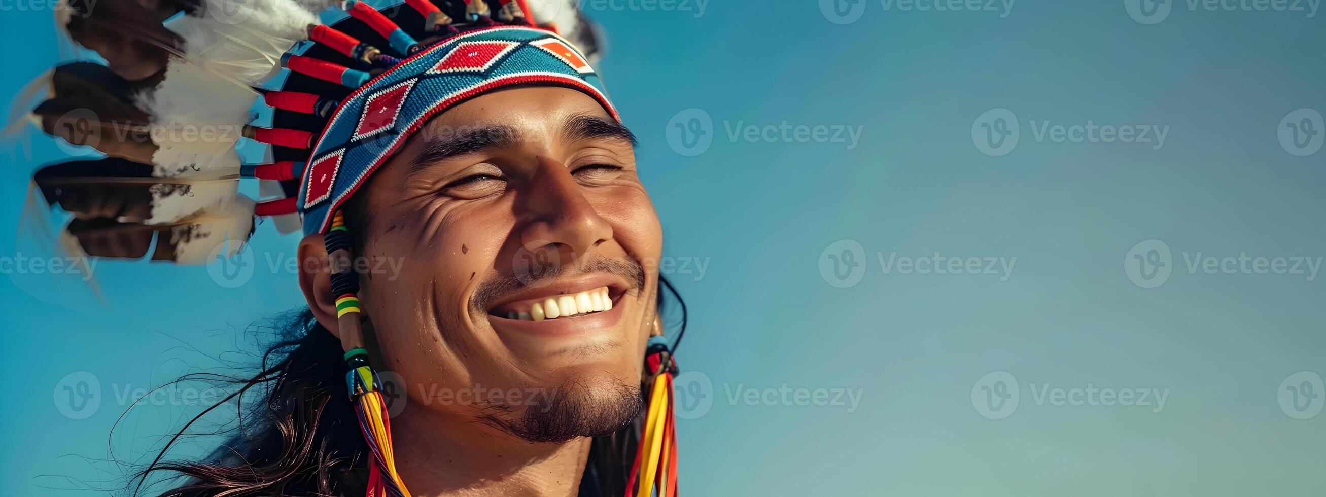 Joyful Indigenous Man Celebrating in Traditional Tribal Dress photo