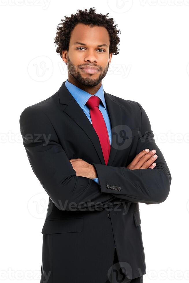 Confident businessman with arms crossed posing in studio setting photo