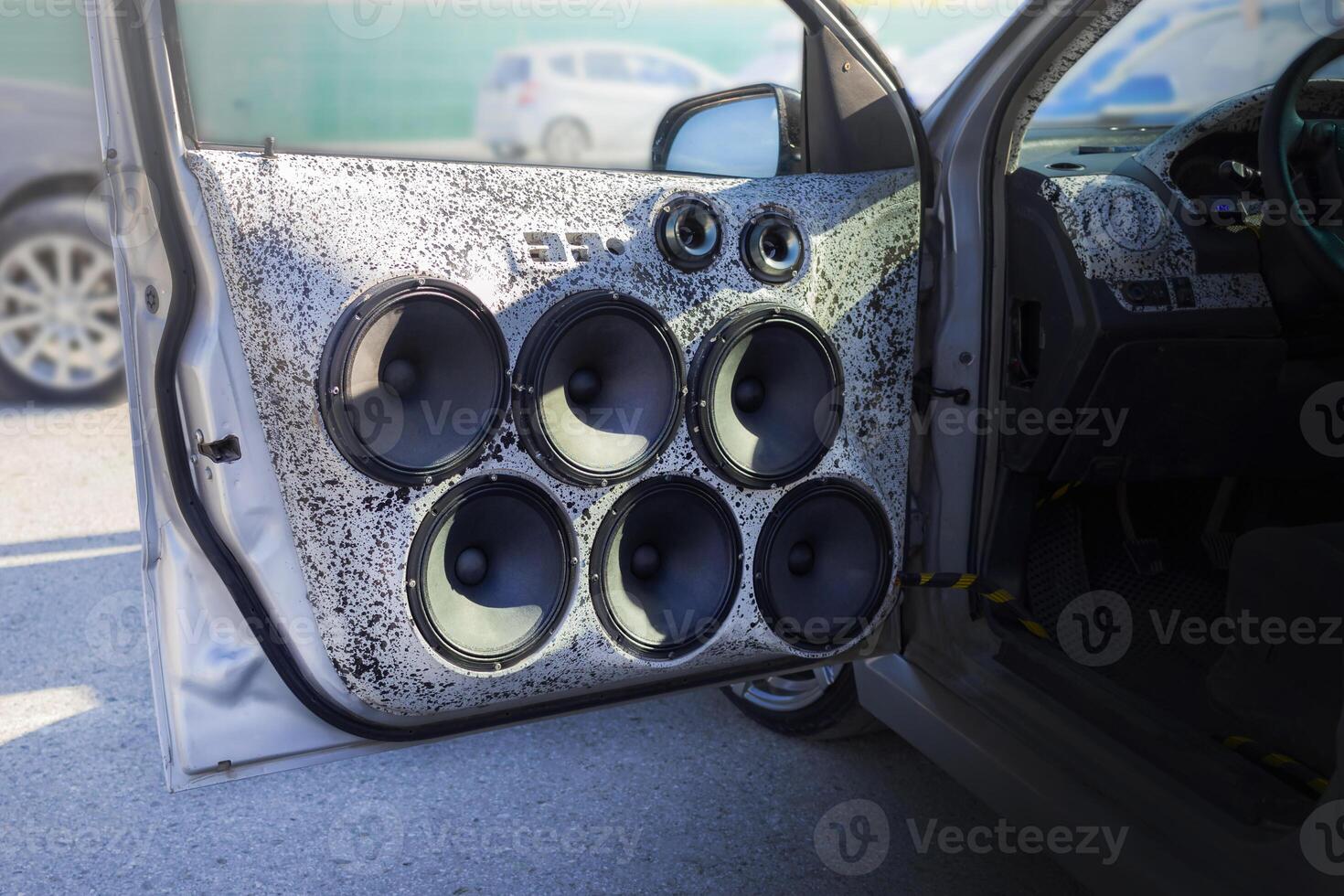 Installed powerful audio speakers in front door of the car photo
