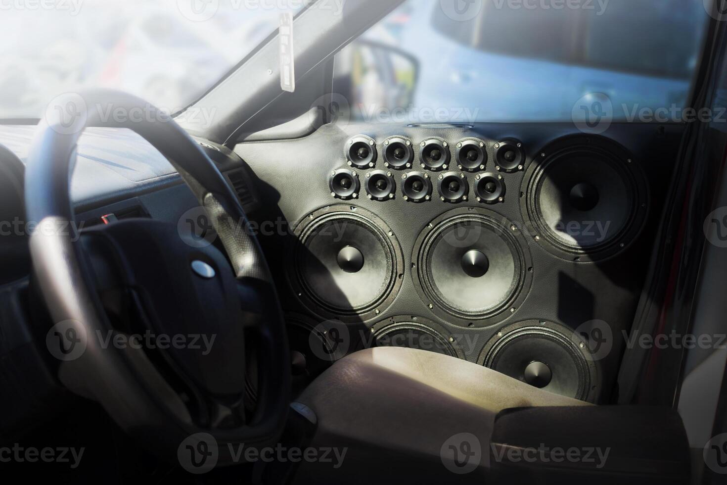Installed powerful audio speakers in front door of the car photo