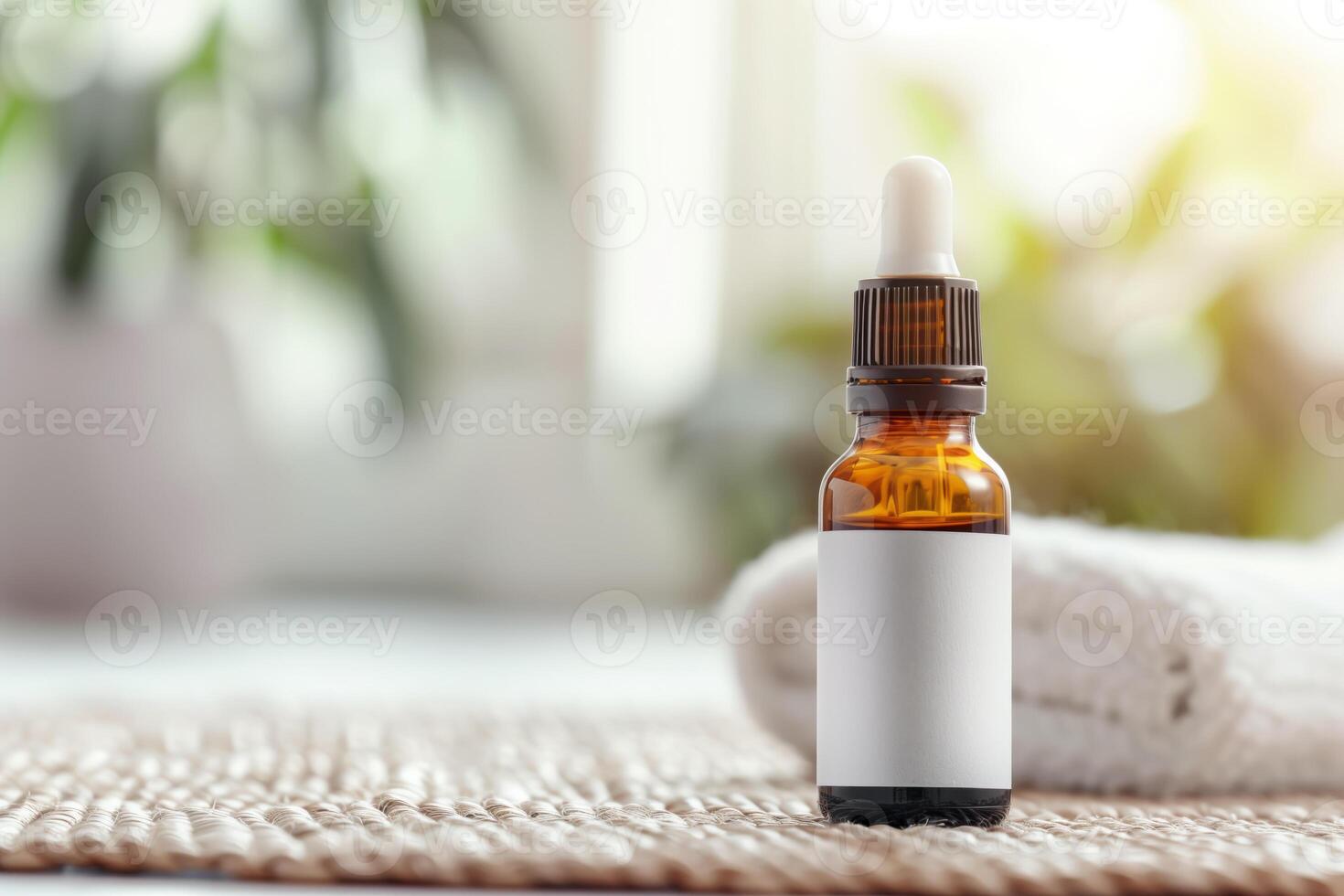 Essential oil dropper bottle on a woven mat with a towel in a soft-focus background, perfect for wellness and spa themes. photo