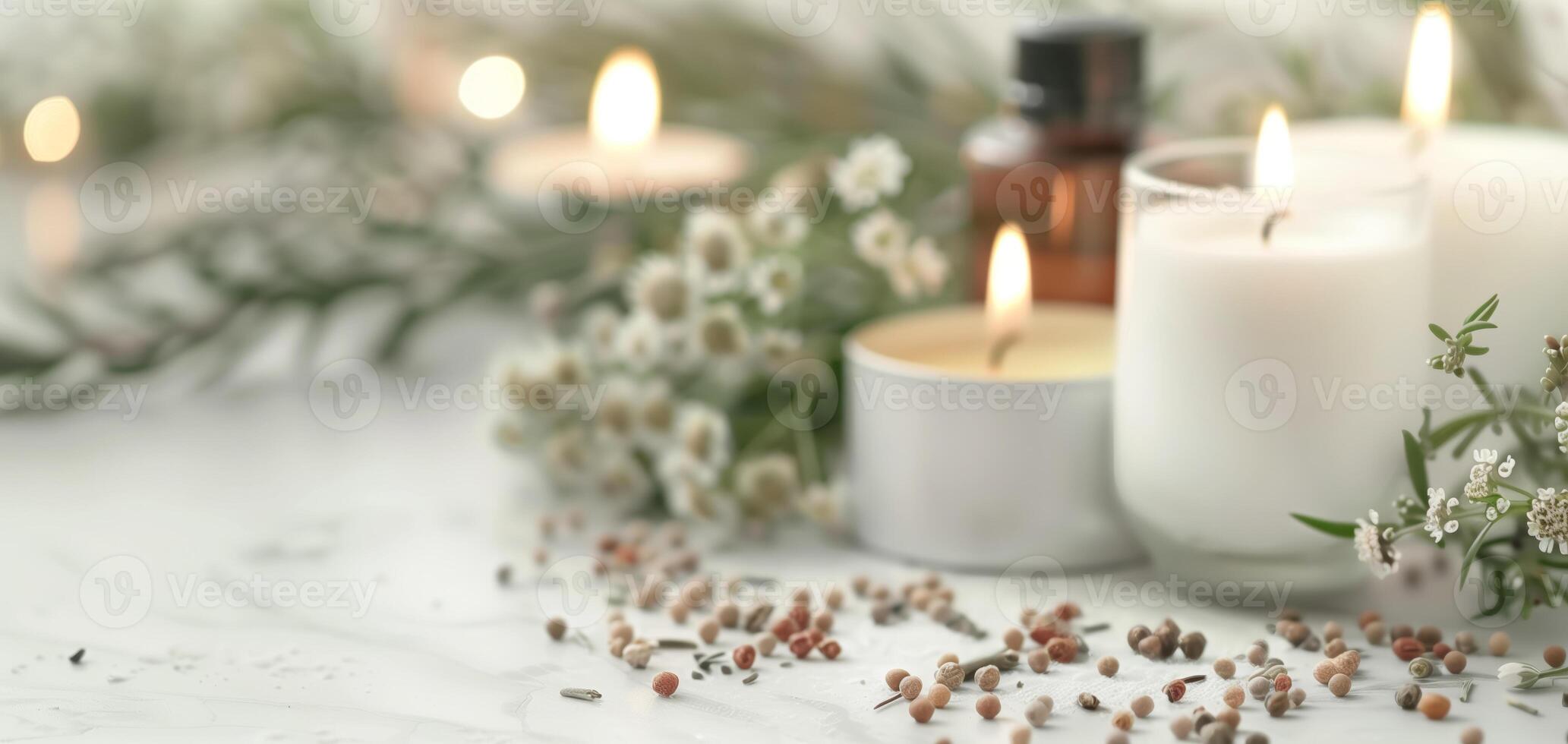 Tranquil spa scene with candles, aromatic oils, and delicate flowers creating a serene atmosphere perfect for relaxation. photo