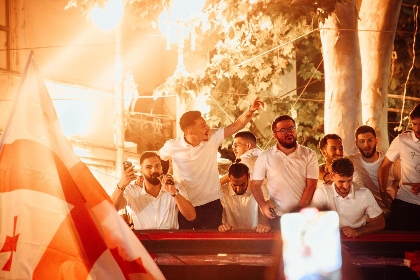 Tbilisi, Georgia - 2nd july, 2024 - Georgian national football team players in open-roof bus on arrival home welcome celebrations in capital city Tbilisi streets. photo