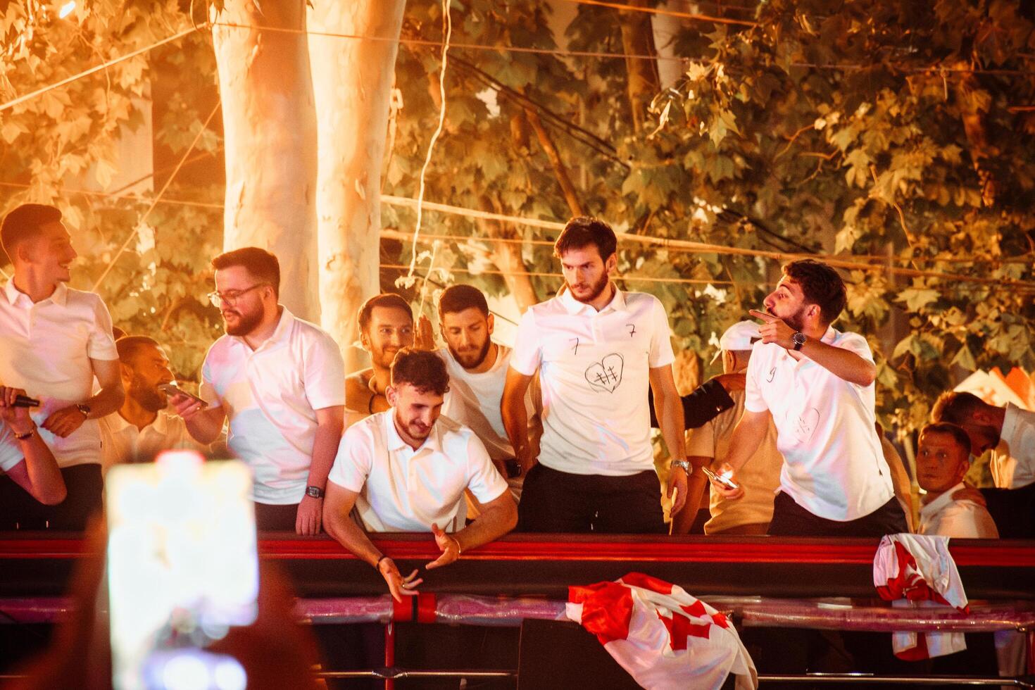 Tbilisi, Georgia - 2nd july, 2024 - Georgian national football team players in open-roof bus on arrival home welcome celebrations in capital city Tbilisi streets. photo