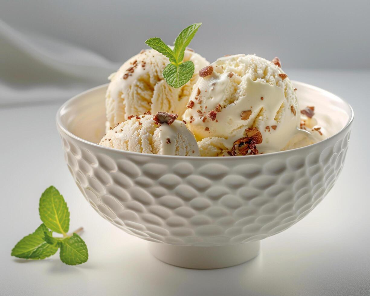 a bowl of ice cream with mint leaves photo