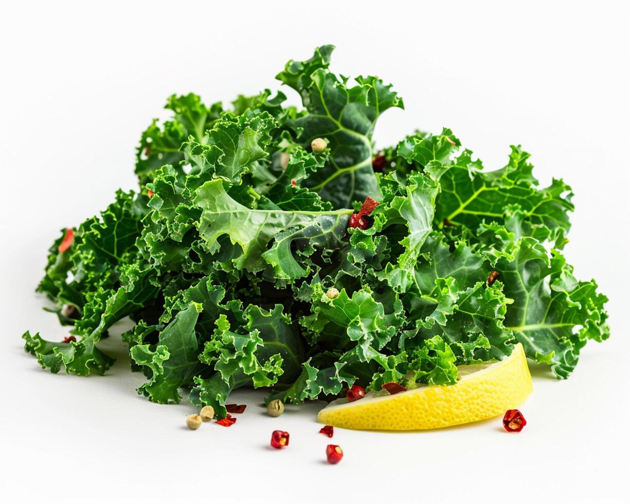 a pile of kale leaves with a lemon on top photo
