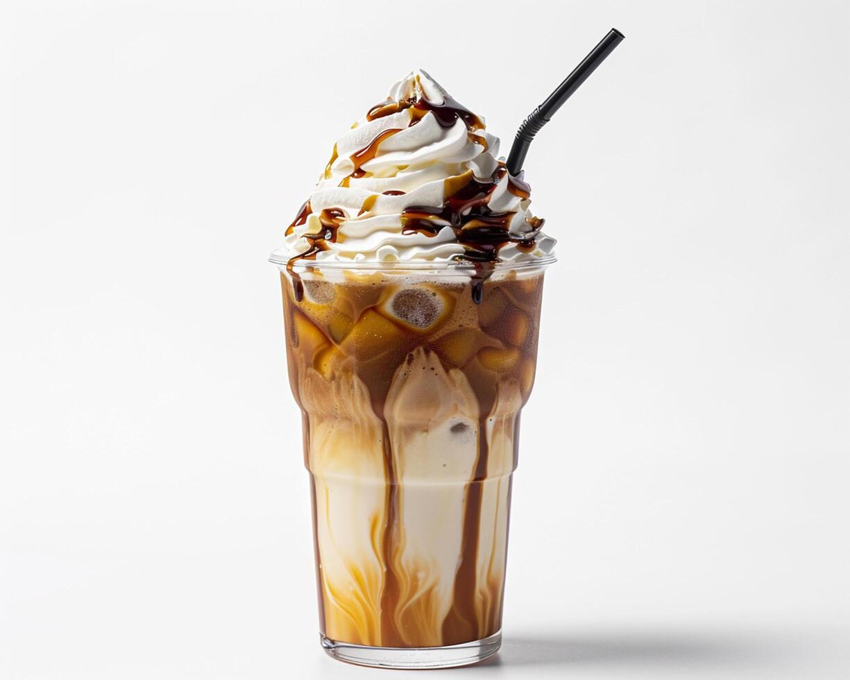 a tall glass of iced coffee with whipped cream and caramel photo