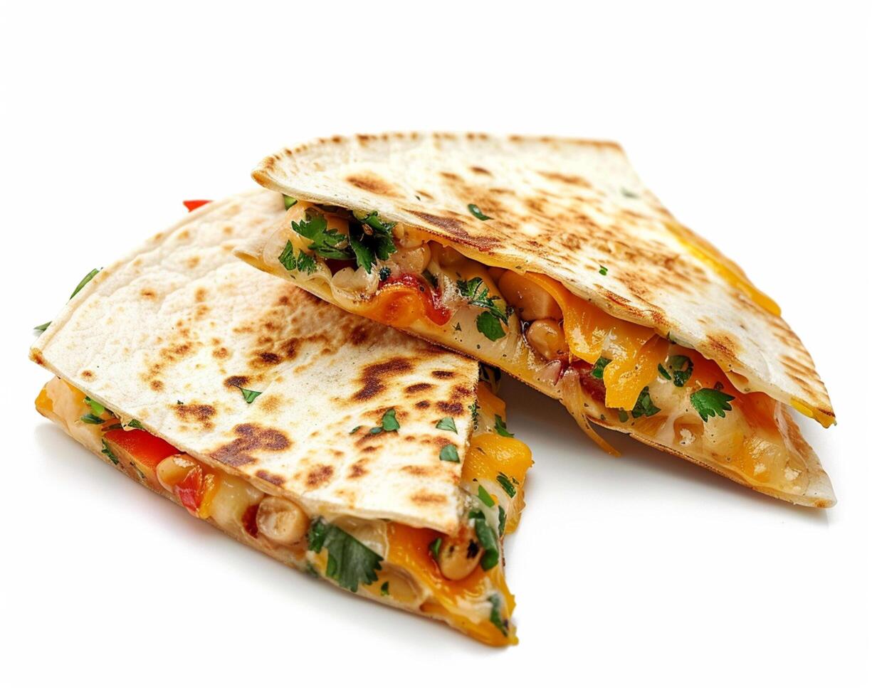 two quesadillas with cheese and vegetables on a white background photo