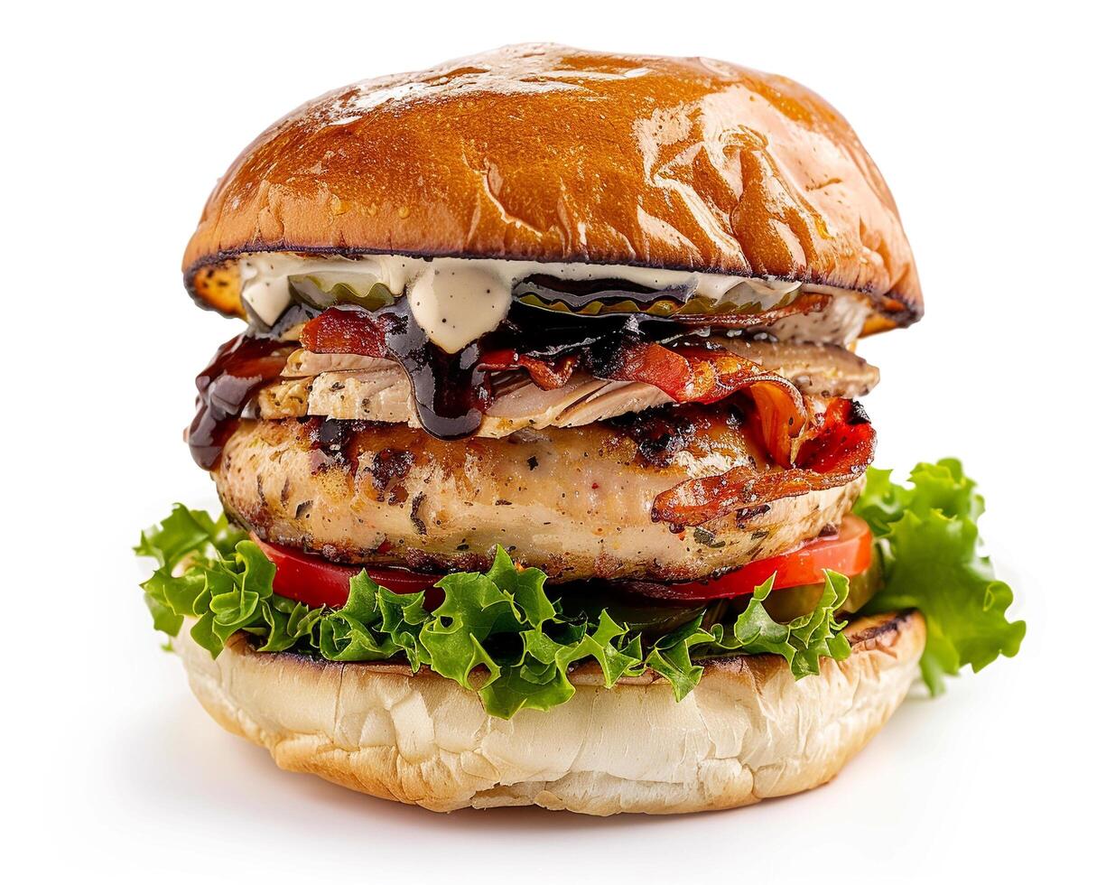 a large burger with meat and vegetables on a bun photo