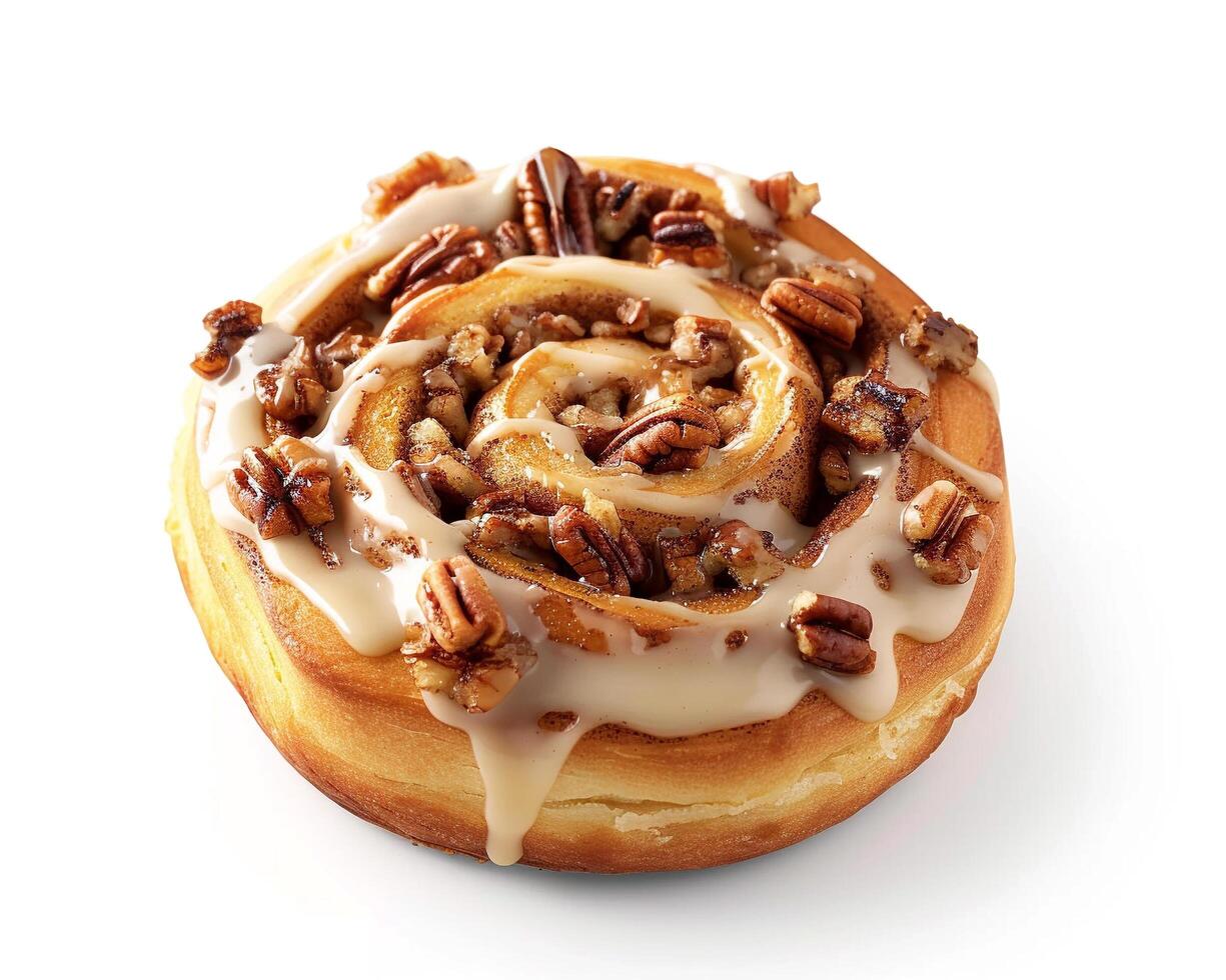 a cinnamon roll with pecans and icing on top photo