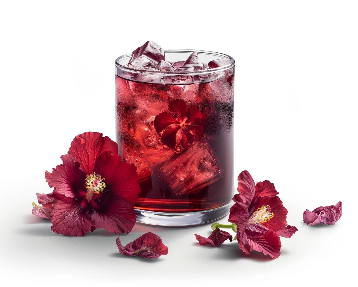 a glass of red drink with ice and flowers photo