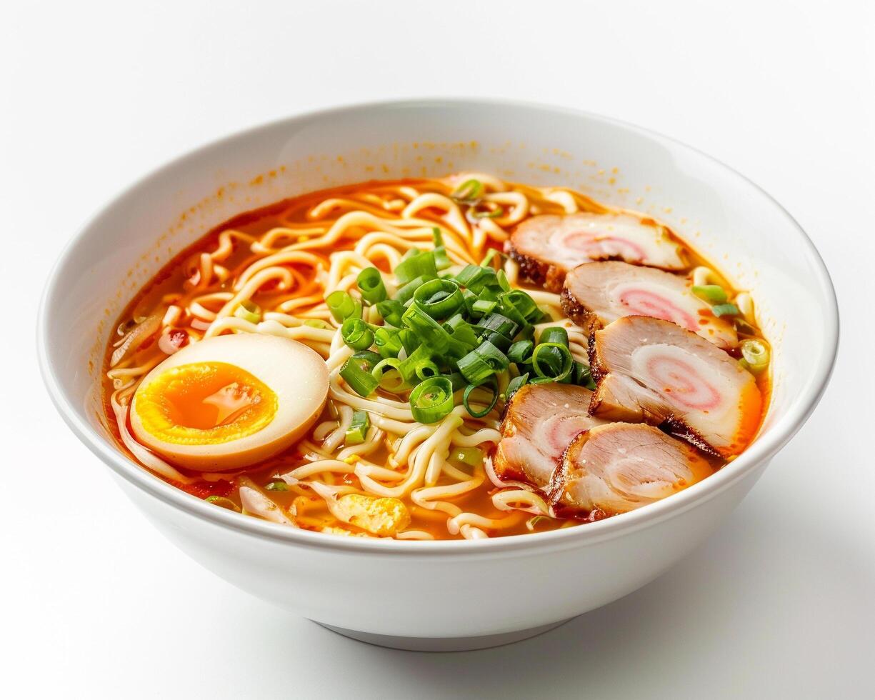 a bowl of ramen with meat, eggs and green onions photo