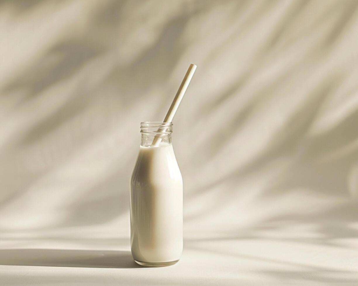 a glass bottle with a straw in it photo