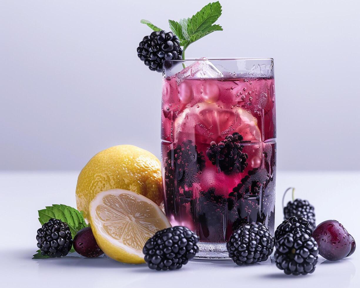 a glass of blackberry lemonade with lemon slices and berries photo