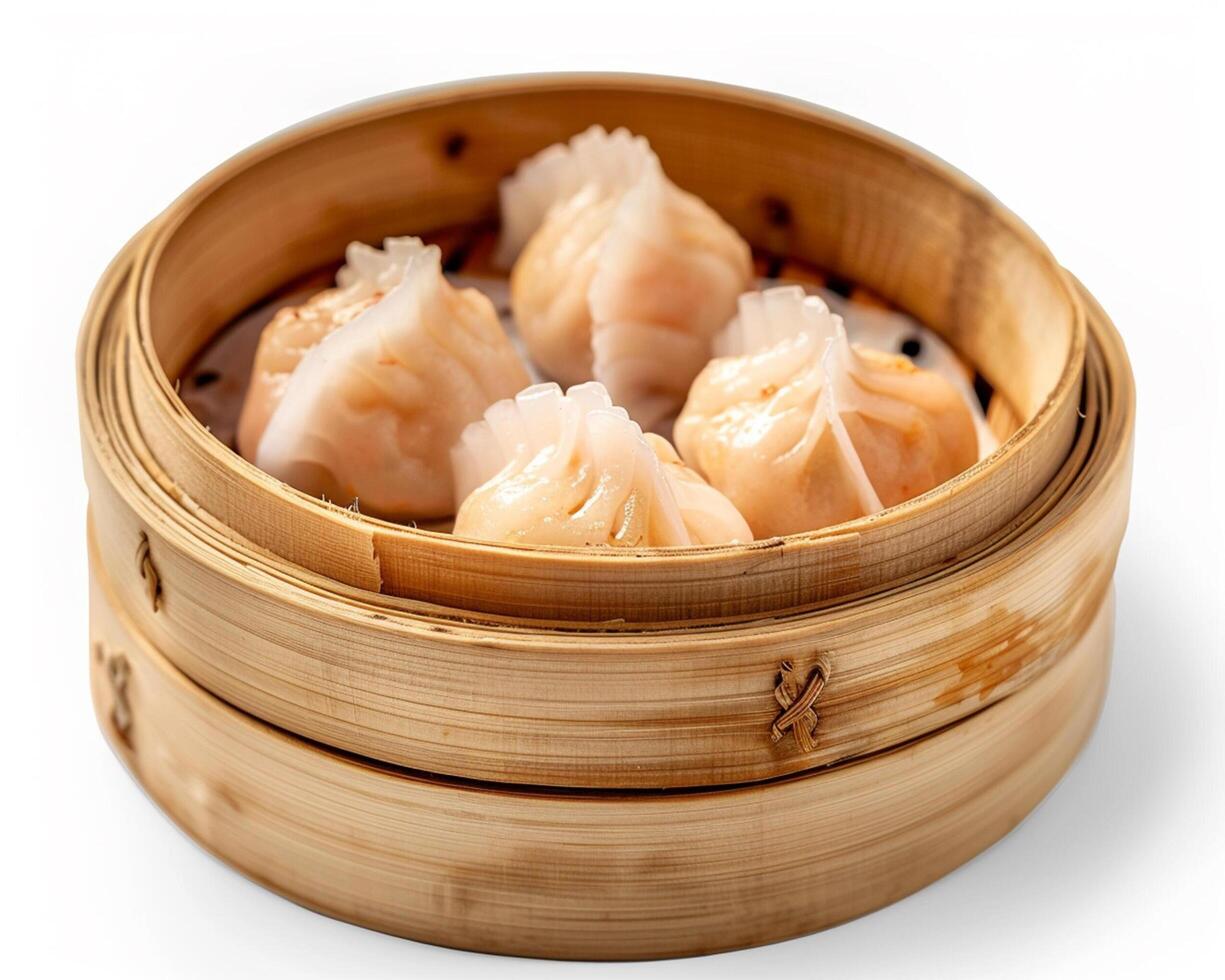 a bamboo steamer with dumplings in it photo