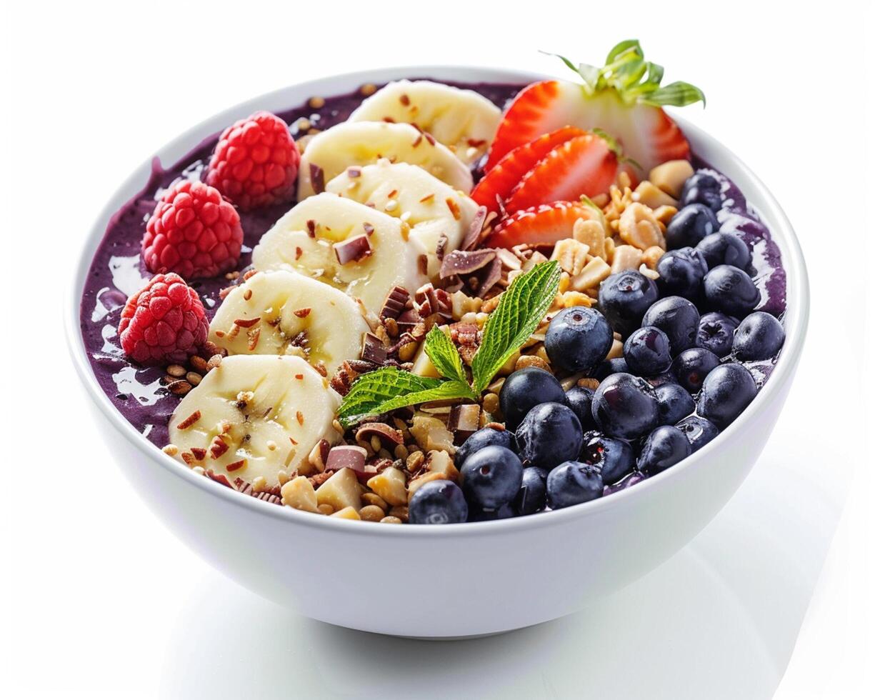 a bowl of blueberry smoothie with bananas, raspberries, and blueberries photo